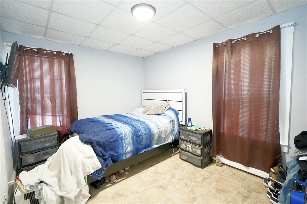 183 Farnham Street Lawrence, MA 01843 - Photo 15 of 38 a bedroom with a bed and a window
