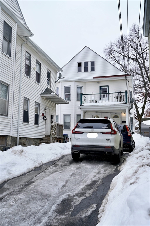 183 Farnham Street Lawrence, MA 01843 - Photo 2 of 38 a view of a street that has couple of cars parked on the road