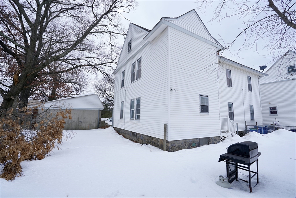 183 Farnham Street Lawrence, MA 01843 - Photo 38 of 38 a view of a white house with a yard and sitting area