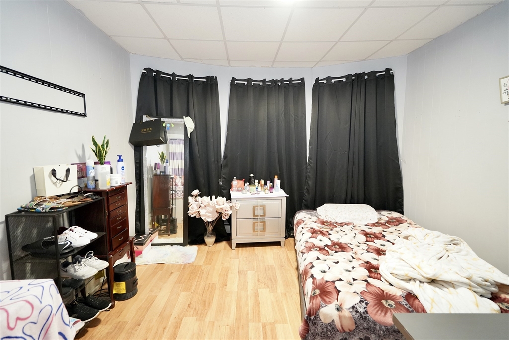 183 Farnham Street Lawrence, MA 01843 - Photo 6 of 38 a bedroom with a bed and a mirror