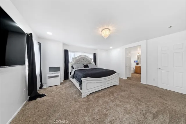 a living room with a bed and furniture