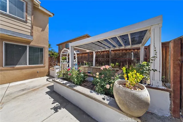 a view of a chairs and table in a patio