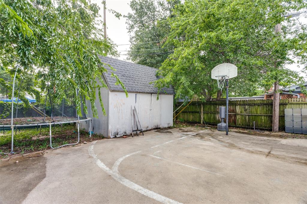 1904 Old Kirk Road Bedford, TX 76022 - Photo 24 of 25 a backyard of a house with portable table and chairs