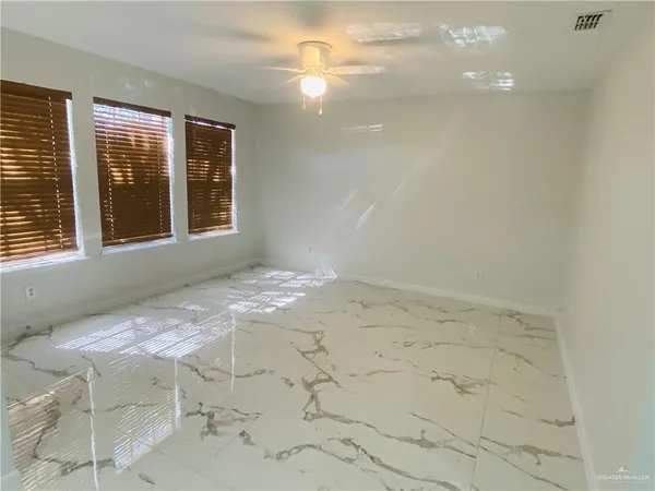 a view of an empty room with a window