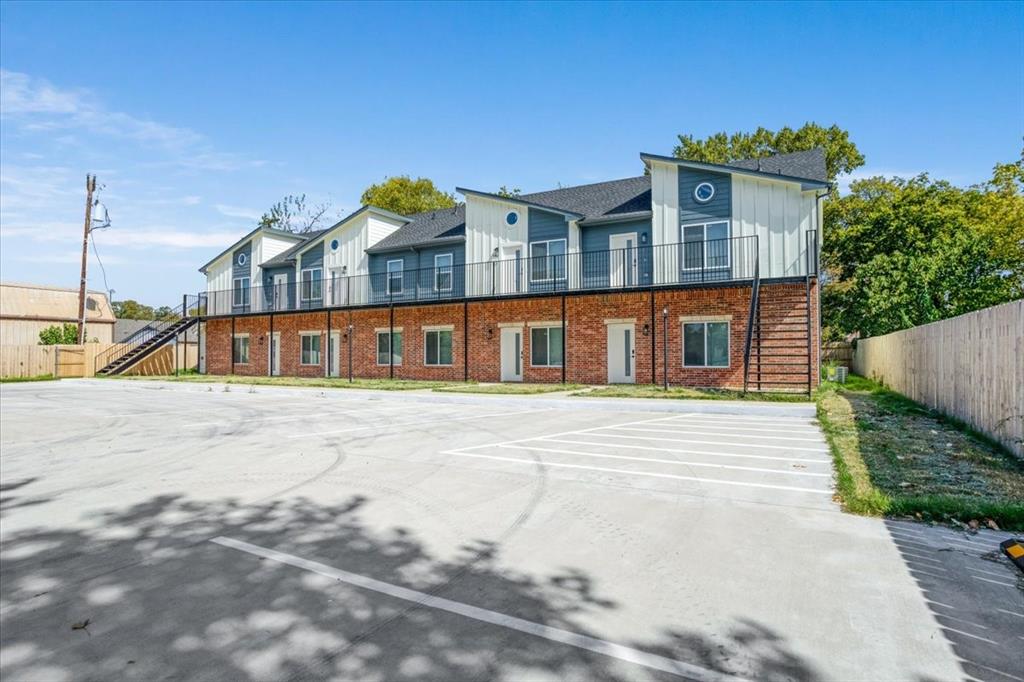 515 South 1st Street, Unit 8 Sherman, TX 75090 - Photo 1 of 7 a front view of a house with a yard