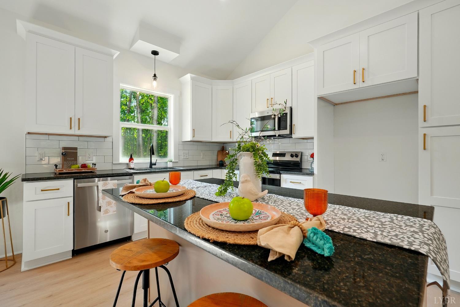 48 Dillon Cabin Road Moneta, VA 24121 - Photo 17 of 33 a kitchen with a sink and a stove top oven