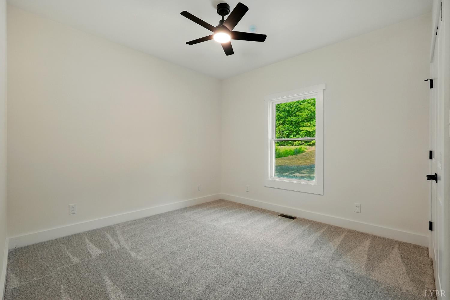48 Dillon Cabin Road Moneta, VA 24121 - Photo 28 of 33 an empty room with a window and a fan