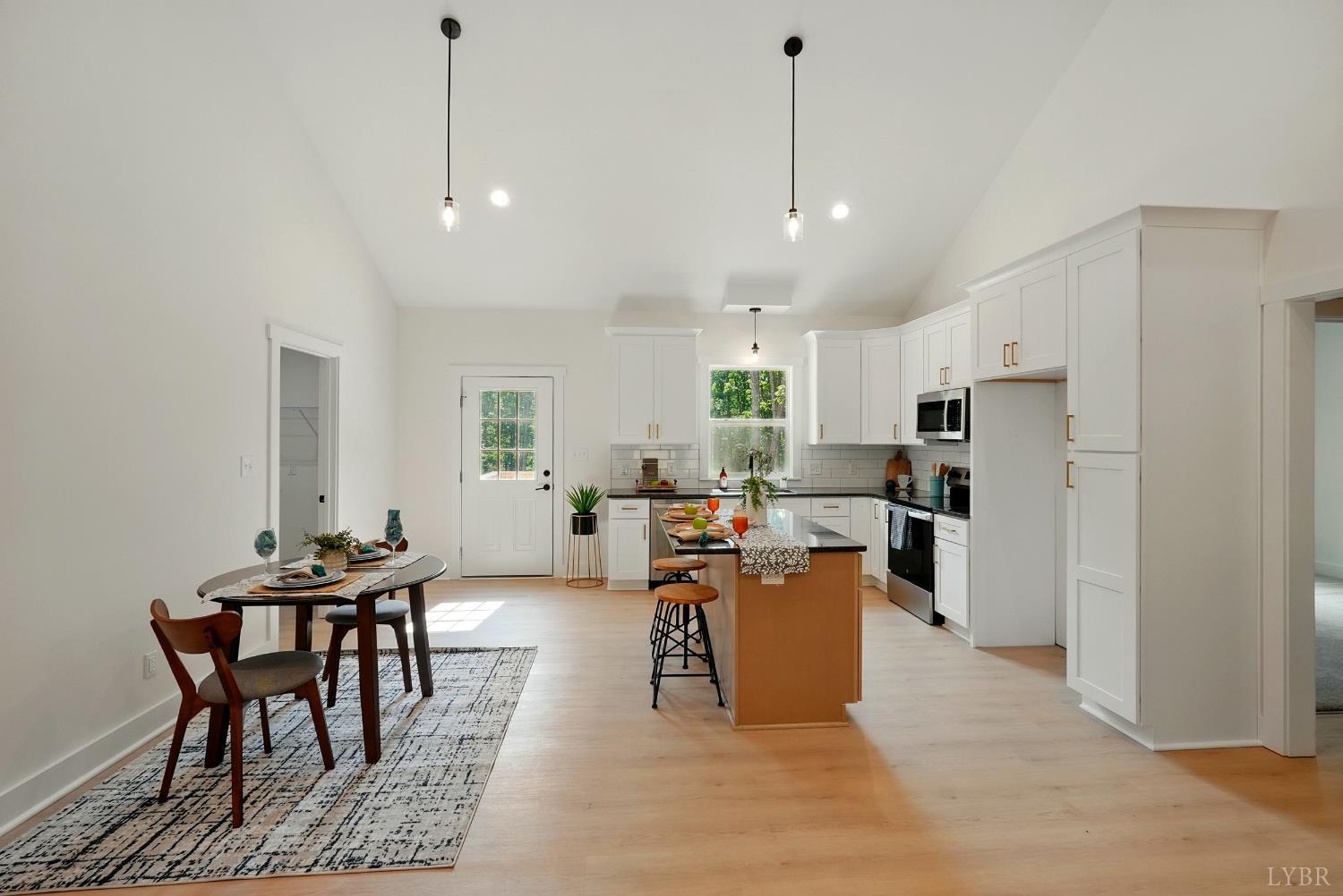 48 Dillon Cabin Road Moneta, VA 24121 - Photo 10 of 33 a living room with stainless steel appliances kitchen island granite countertop furniture and a wooden floor