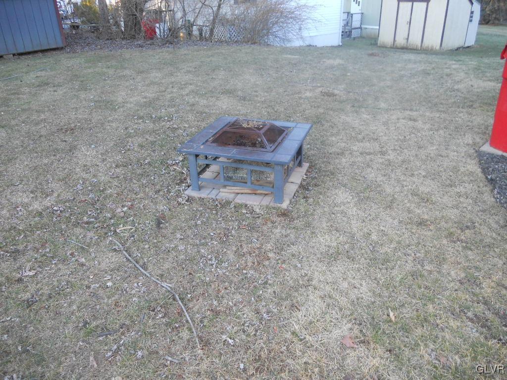 8733 Turkey Ridge Road Breinigsville, PA 18031 - Photo 16 of 19 a room with a bench