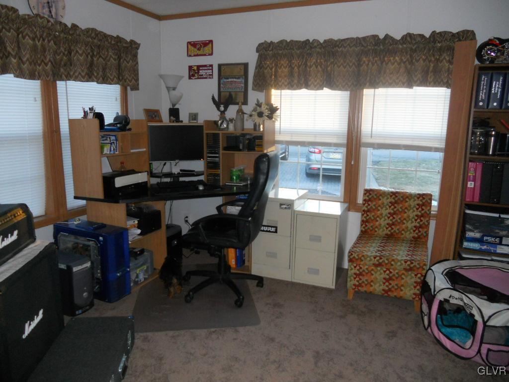 8733 Turkey Ridge Road Breinigsville, PA 18031 - Photo 7 of 19 a view of a workspace with furniture and a window
