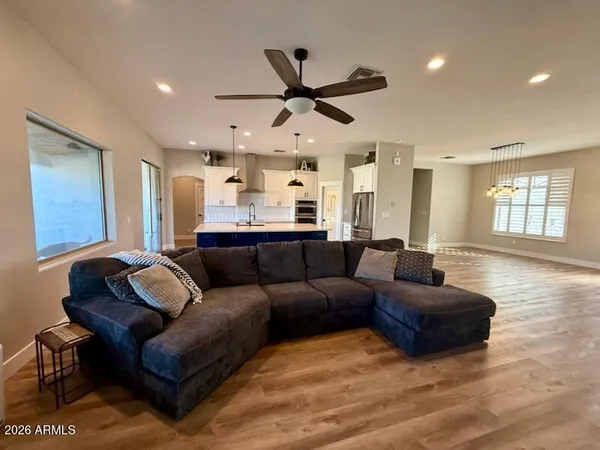 a living room with furniture and a large window