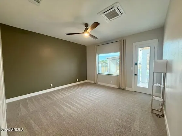 a view of an empty room with a window