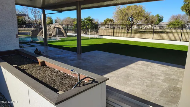 a view of a swimming pool with a patio