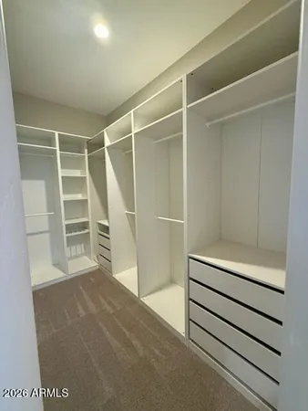 a view of a two chairs in the park