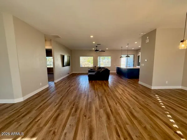 a view of living room with furniture and wooden floor