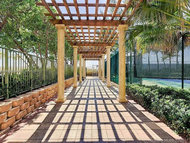 a view of a balcony with wooden floor