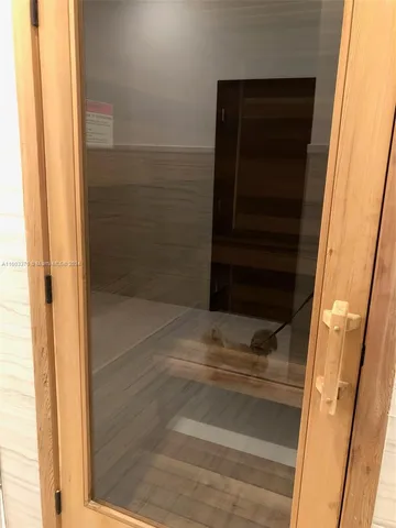a white toilet sitting next to a bathroom sink and tub