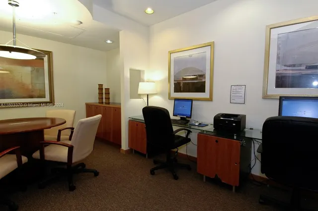 a white toilet sitting next to a shower