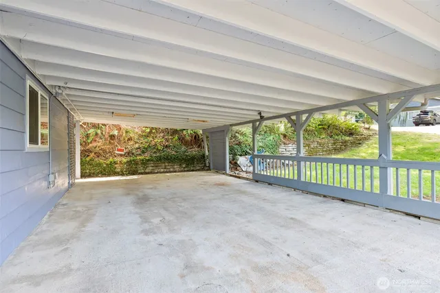 a view of a room with large windows