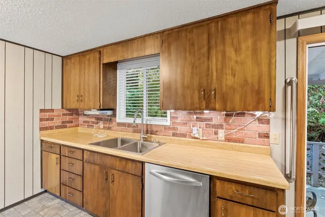 a bathroom with a sink and a large mirror