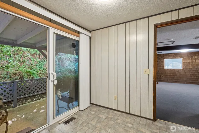 a view of a back yard from a room