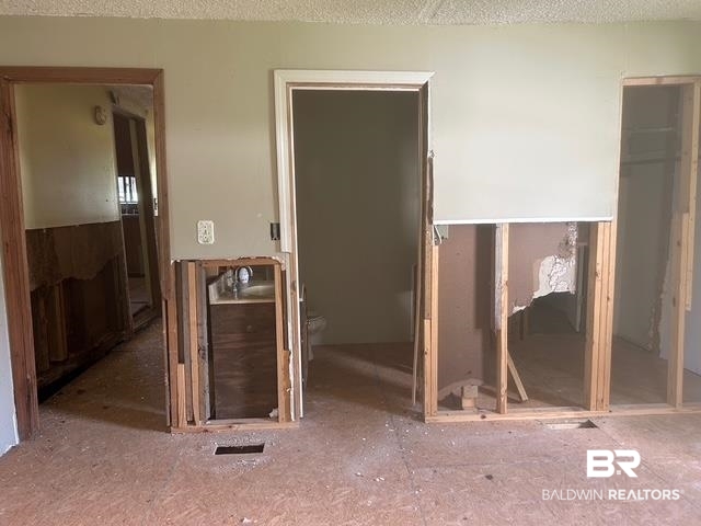 25548 Newman Road Daphne, AL 36526 - Photo 7 of 15 Unfurnished bedroom featuring a spacious closet