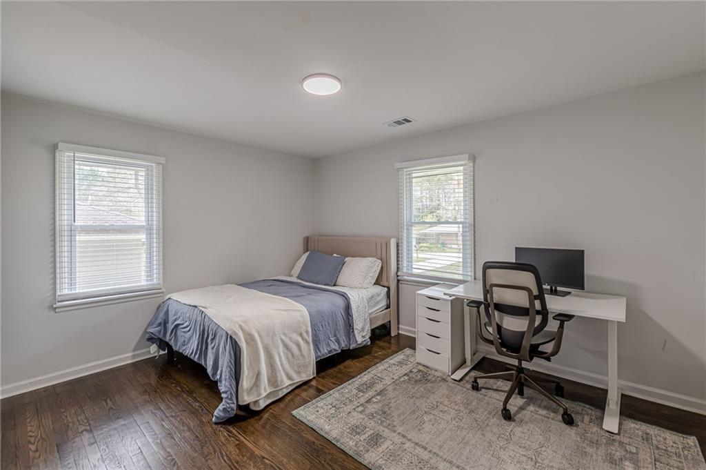 1692 Derrill Drive Decatur, GA 30032 - Photo 17 of 29 a bedroom with a bed a desk and chair