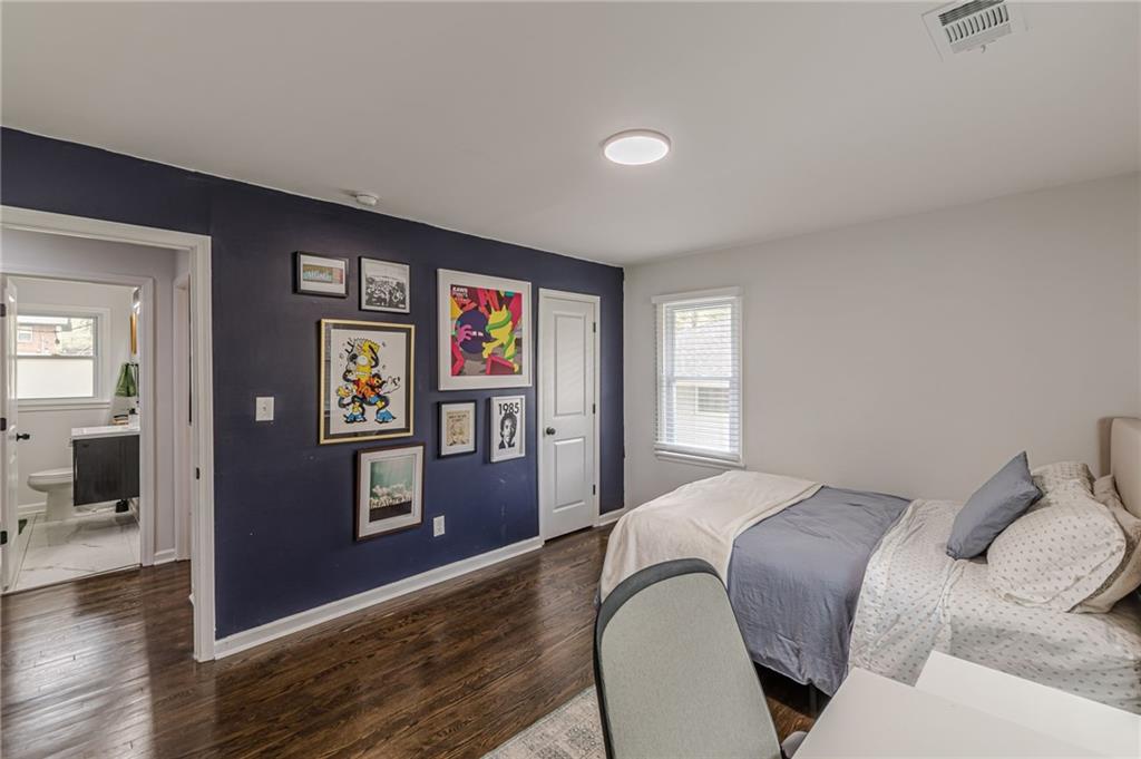 1692 Derrill Drive Decatur, GA 30032 - Photo 18 of 29 a bedroom with a bed and wooden floor