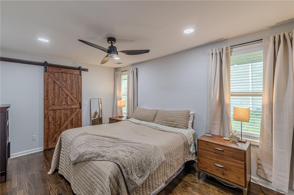 1692 Derrill Drive Decatur, GA 30032 - Photo 20 of 29 a bedroom with a bed and a chandelier