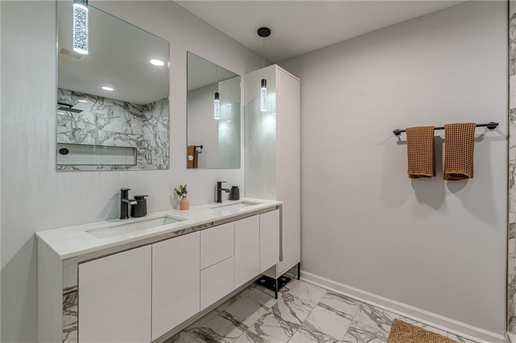 1692 Derrill Drive Decatur, GA 30032 - Photo 21 of 29 a bathroom with a sink a mirror and vanity