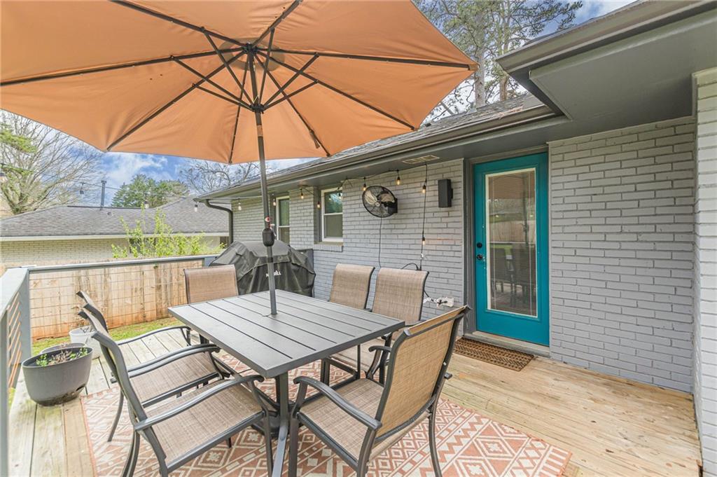 1692 Derrill Drive Decatur, GA 30032 - Photo 24 of 29 a view of patio with table and chairs under an umbrella