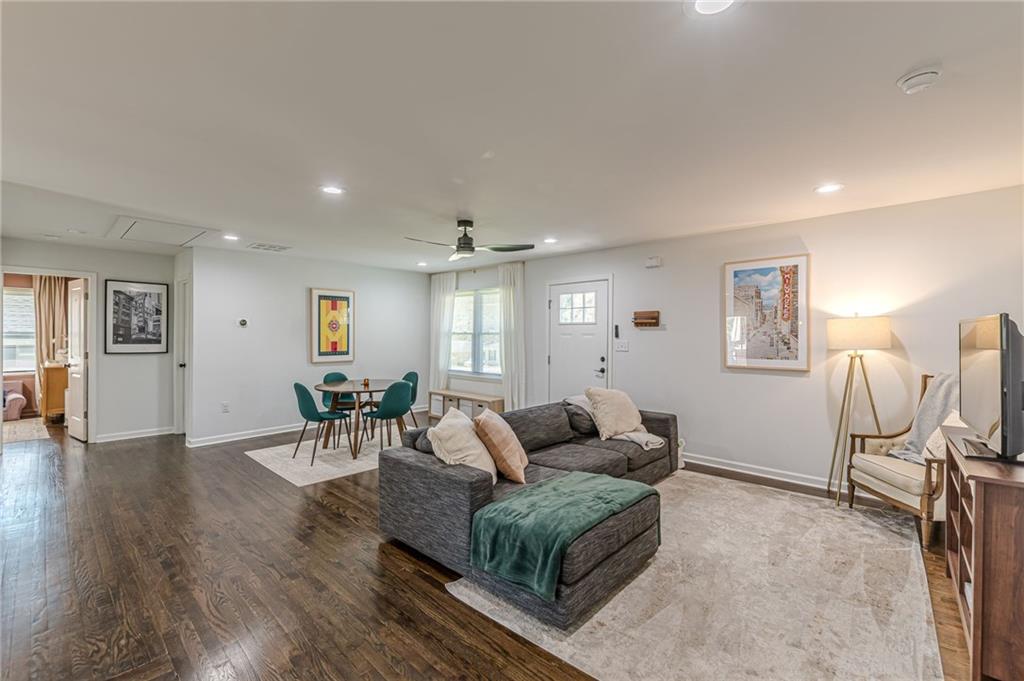 1692 Derrill Drive Decatur, GA 30032 - Photo 4 of 29 a living room with furniture a dining table and wooden floor