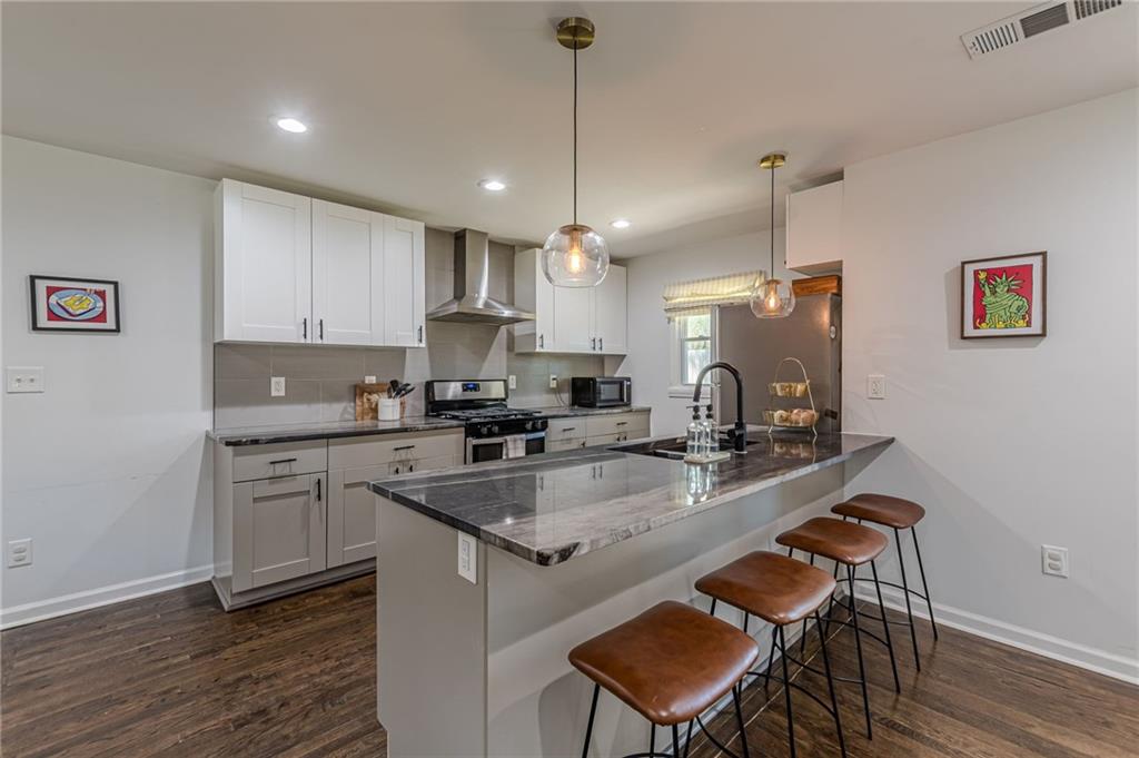 1692 Derrill Drive Decatur, GA 30032 - Photo 8 of 29 a kitchen with a sink a counter space appliances and cabinets