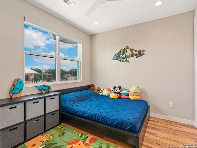 a bed room with a bed and a window