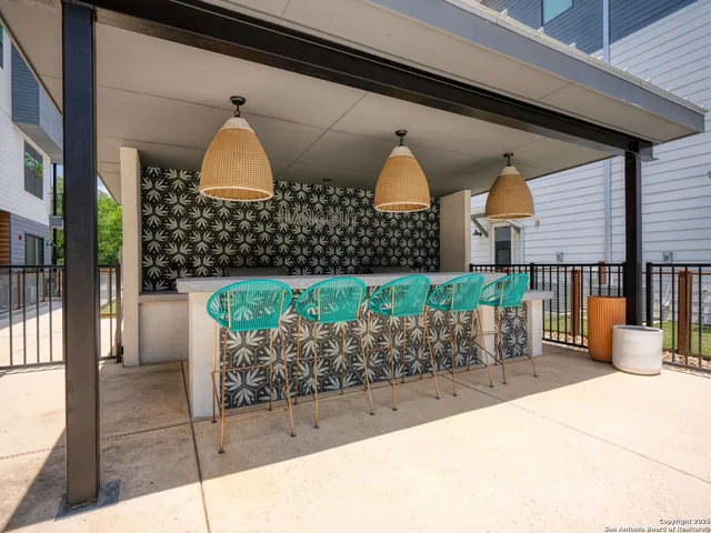 a front view of a house with outdoor seating area