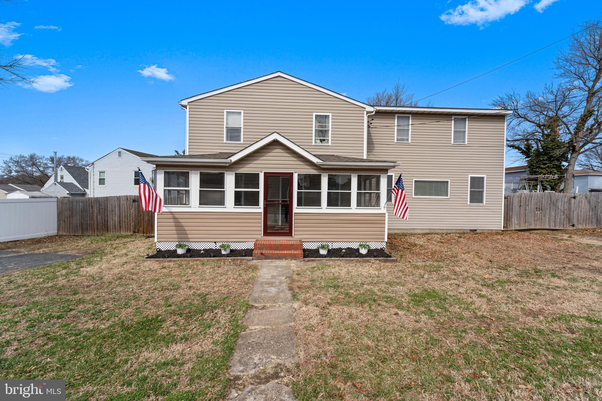 910 Hilltop Road Curtis Bay, MD 21226 - Photo 1 of 28 a house with trees in the background