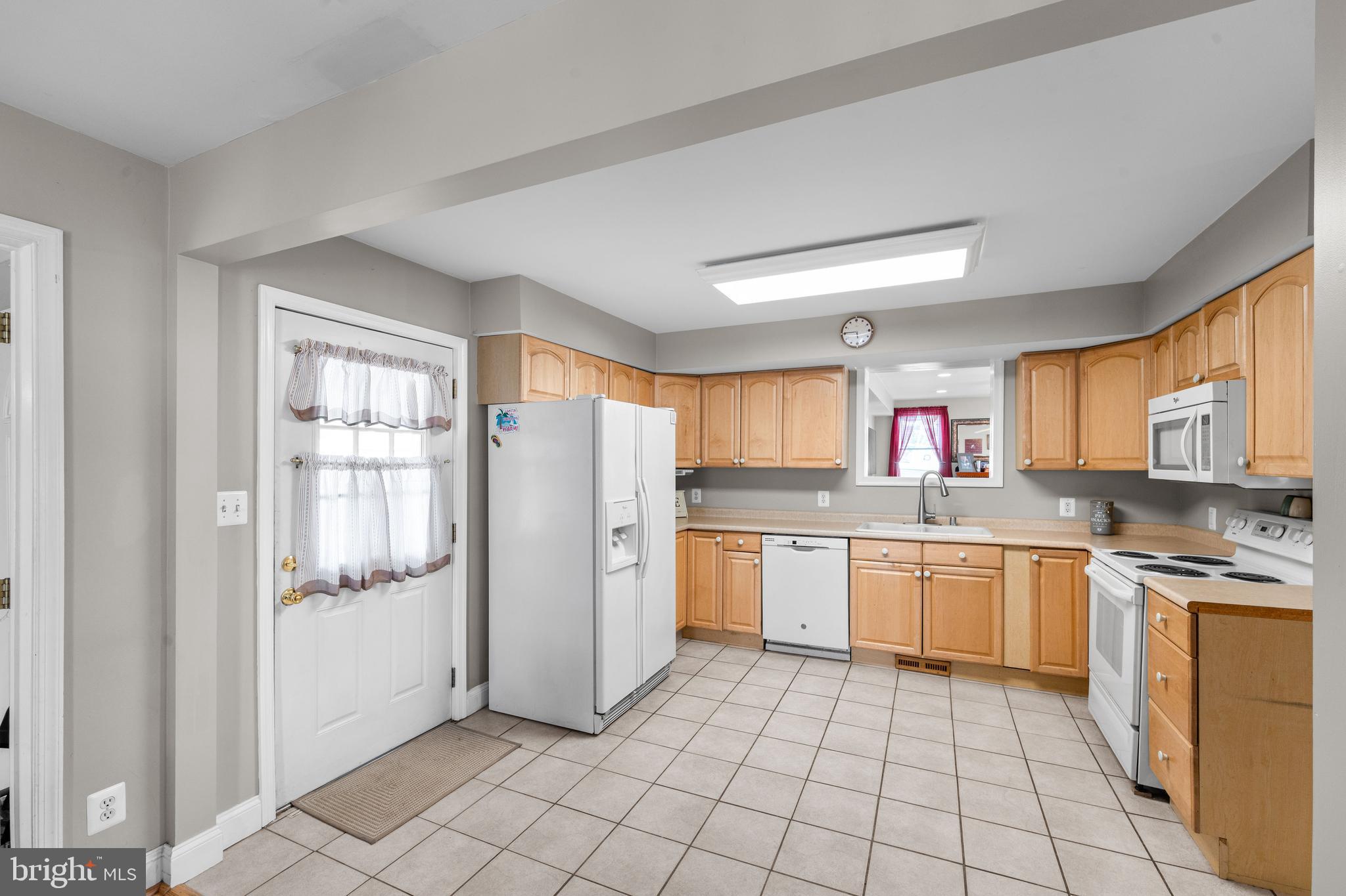 910 Hilltop Road Curtis Bay, MD 21226 - Photo 11 of 28 a kitchen with stainless steel appliances granite countertop a refrigerator and a sink