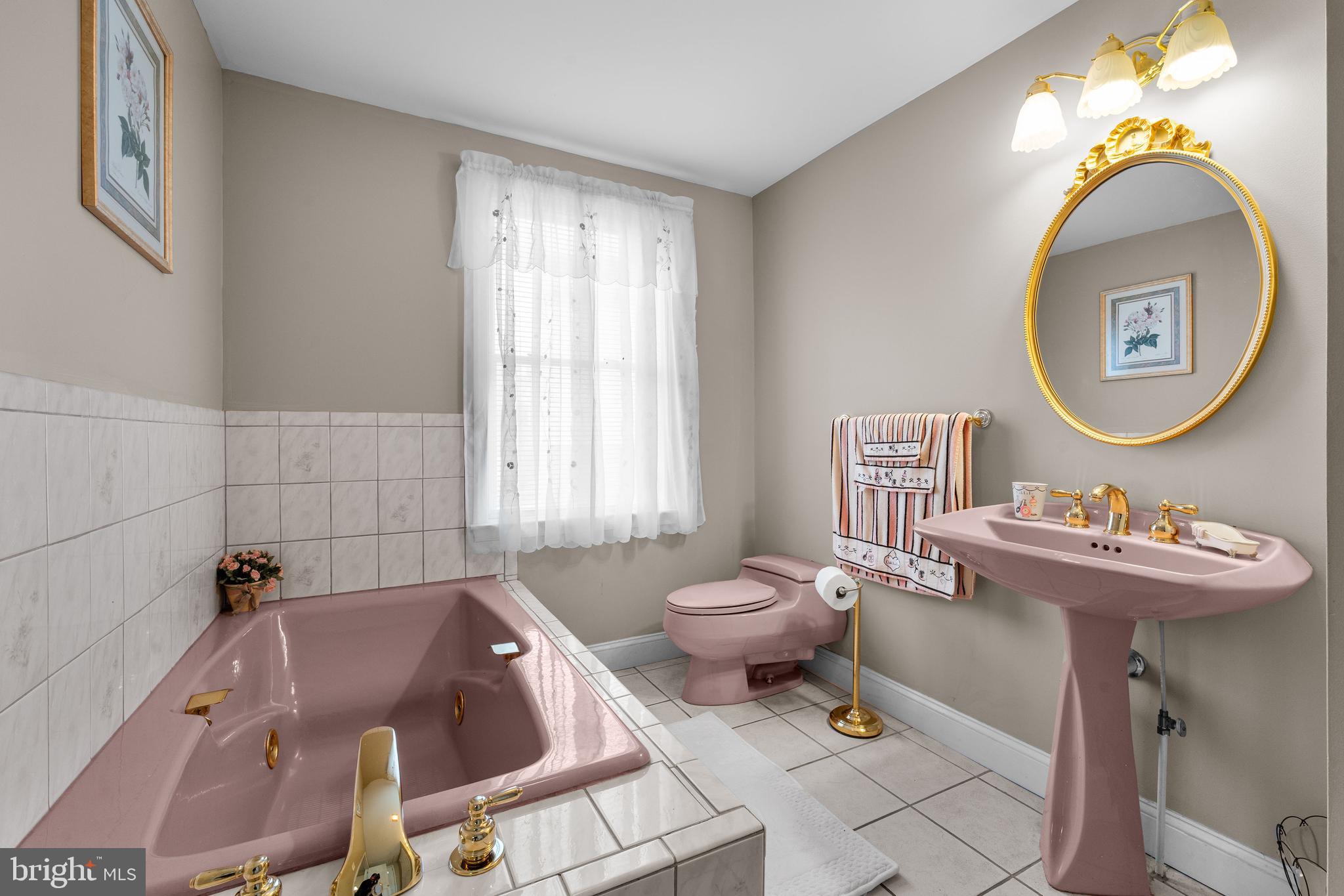 910 Hilltop Road Curtis Bay, MD 21226 - Photo 13 of 28 a bathroom with a sink mirror bathtub and toilet