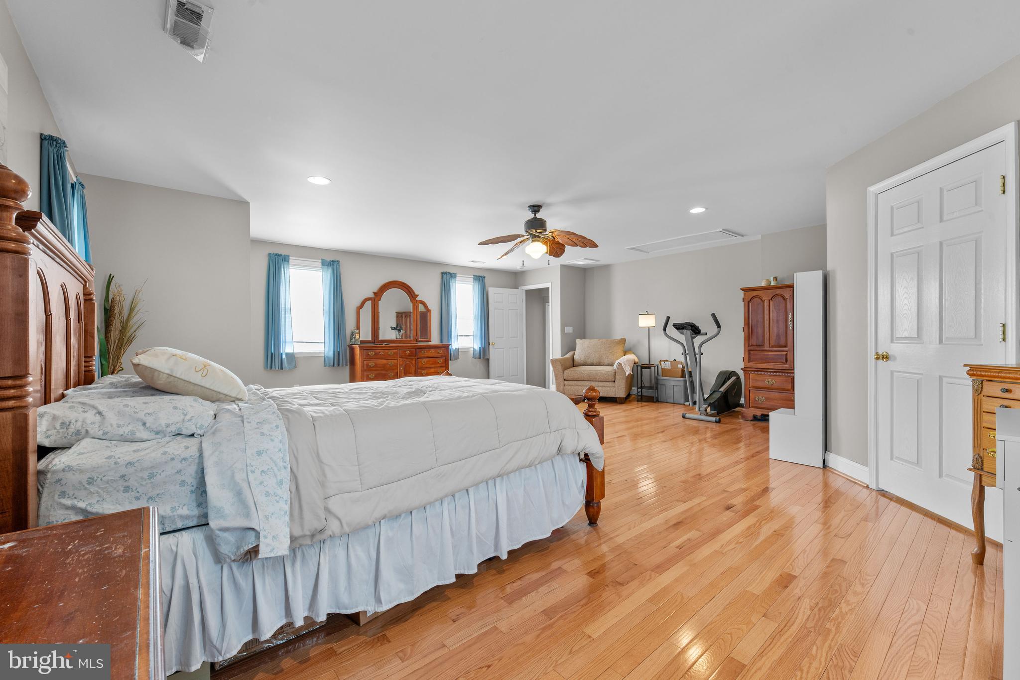 910 Hilltop Road Curtis Bay, MD 21226 - Photo 15 of 28 a bedroom with bed and wooden floor
