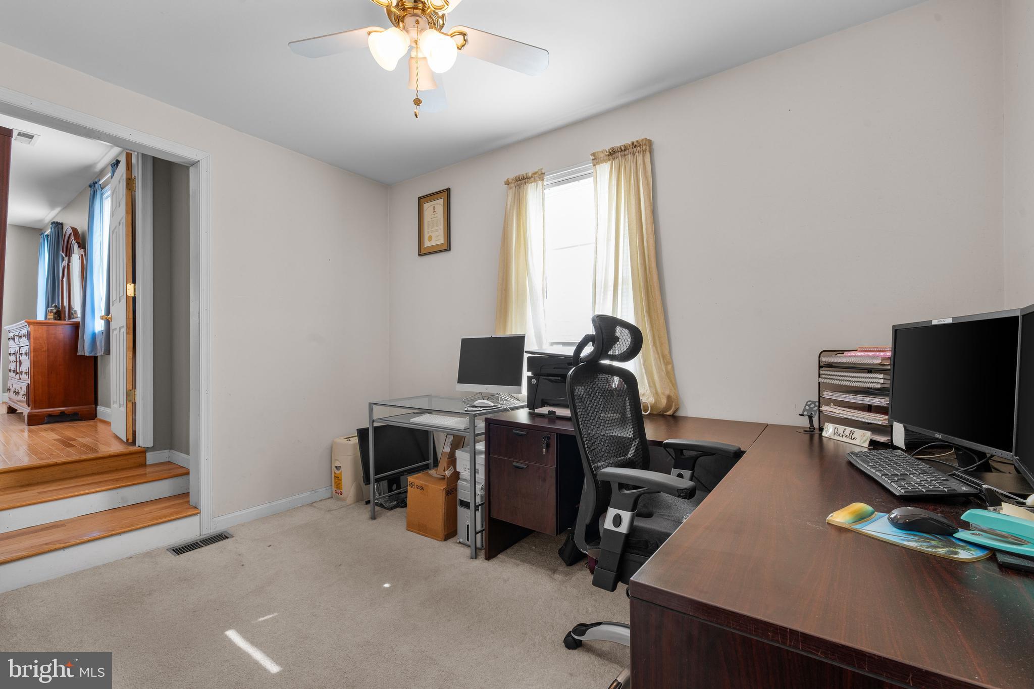 910 Hilltop Road Curtis Bay, MD 21226 - Photo 16 of 28 a view of a workspace with furniture and a window