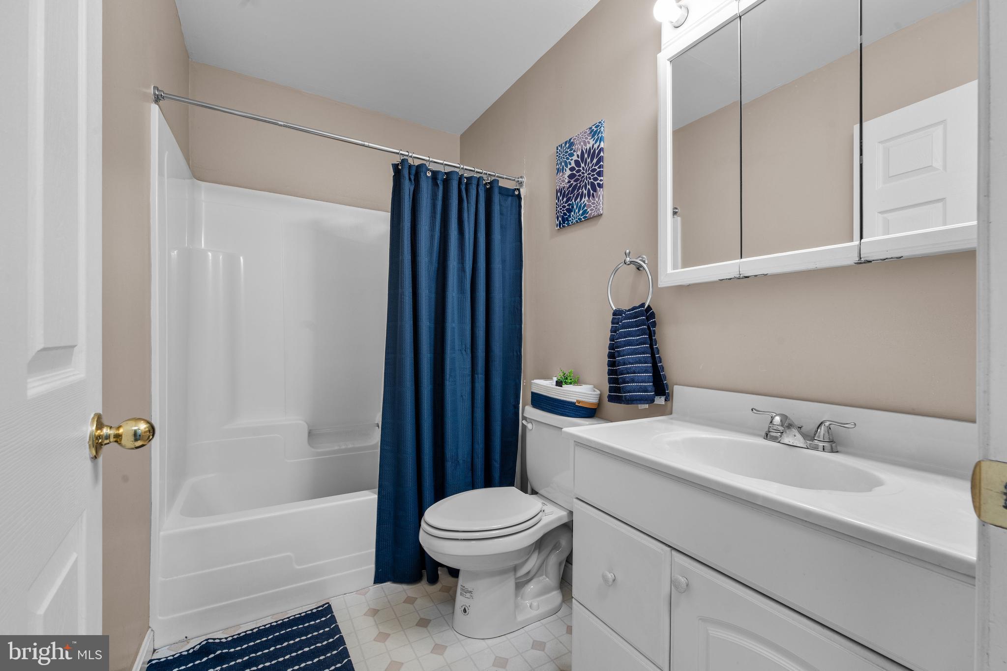 910 Hilltop Road Curtis Bay, MD 21226 - Photo 21 of 28 a bathroom with a sink toilet and shower