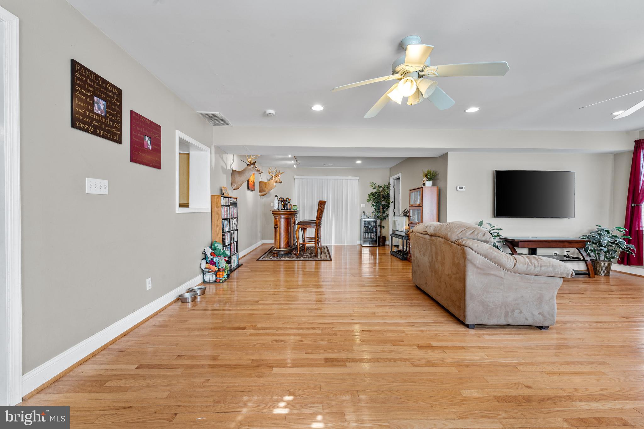 910 Hilltop Road Curtis Bay, MD 21226 - Photo 8 of 28 a living room with furniture and a flat screen tv