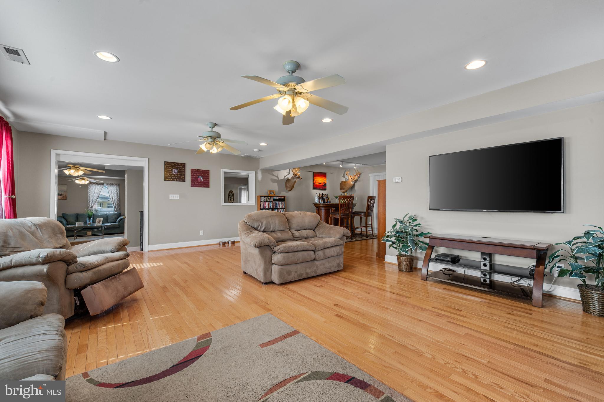 910 Hilltop Road Curtis Bay, MD 21226 - Photo 9 of 28 a living room with furniture and a flat screen tv