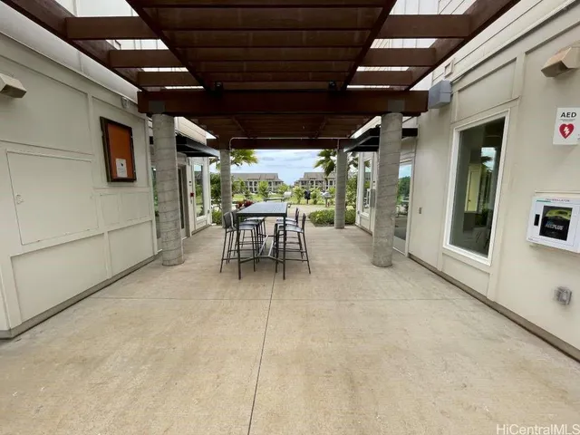 a view of a patio with table and chairs