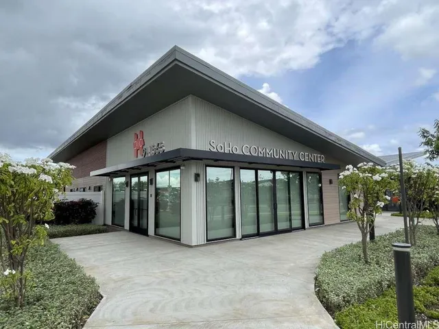 a view of a patio with table and chairs and potted plants