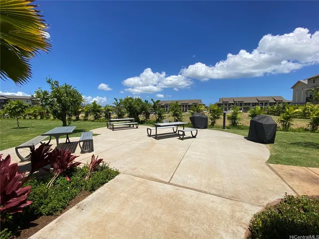 a view of swimming pool with seating space and hardwood