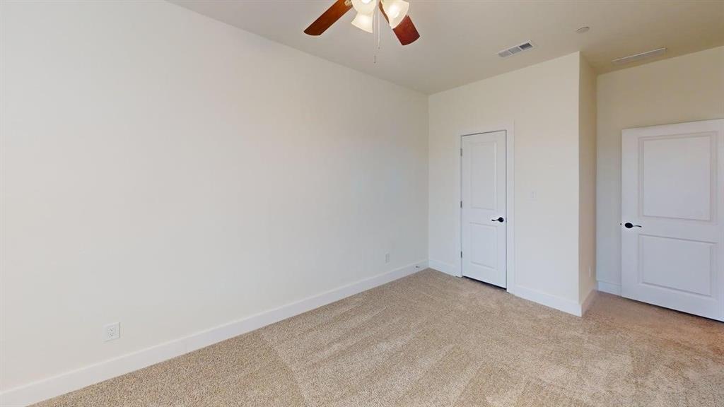 353 Buck Ridge Drive Little Elm, TX 75068 - Photo 12 of 23 Unfurnished bedroom with light carpet and ceiling fan