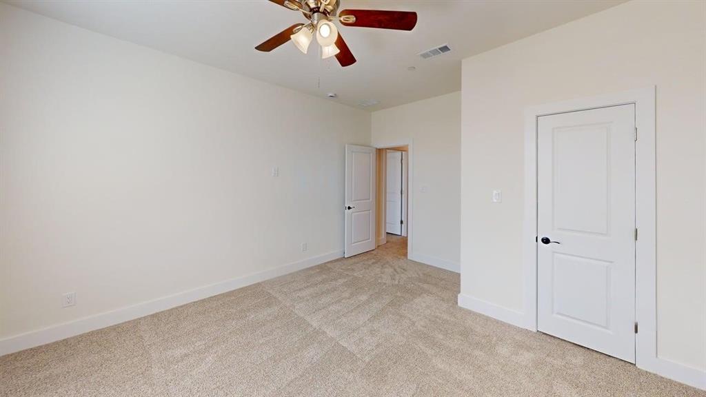 353 Buck Ridge Drive Little Elm, TX 75068 - Photo 14 of 23 Unfurnished bedroom featuring light colored carpet and a ceiling fan