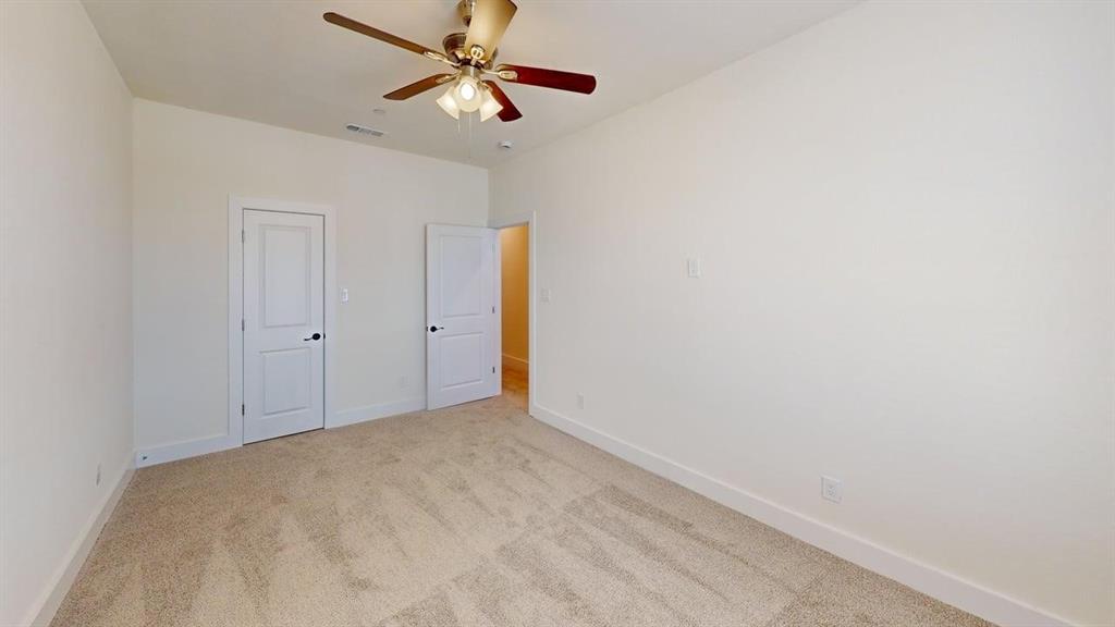 353 Buck Ridge Drive Little Elm, TX 75068 - Photo 16 of 23 Unfurnished bedroom with light carpet and ceiling fan