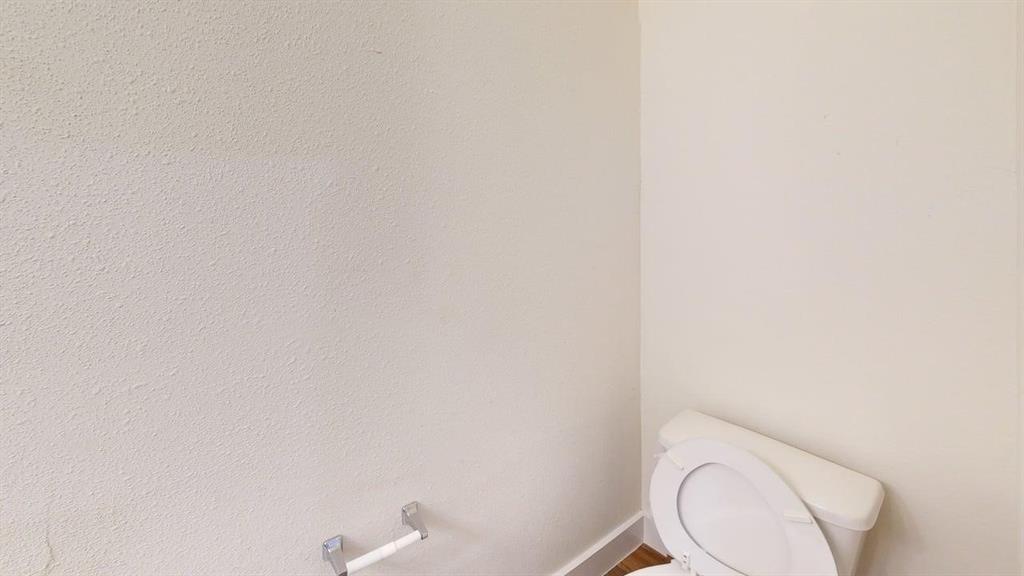 353 Buck Ridge Drive Little Elm, TX 75068 - Photo 19 of 23 Bathroom with toilet and baseboards